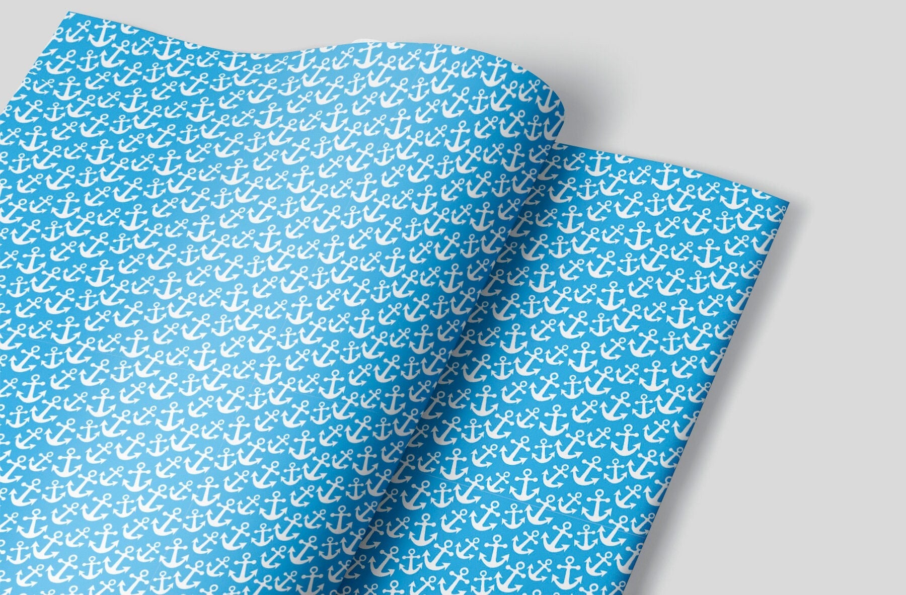 A blue wrapping paper sheet with White boat anchors